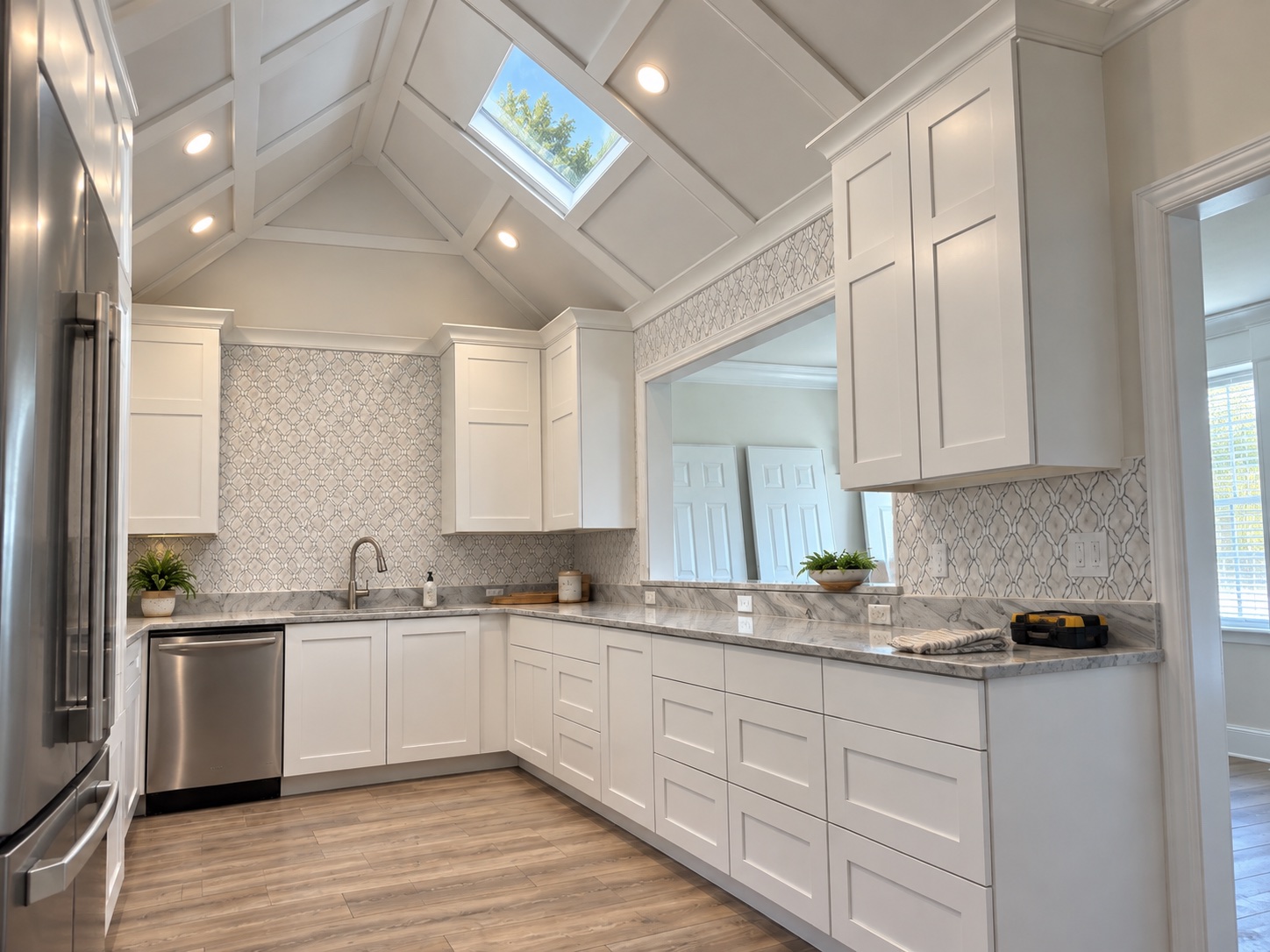 Kitchen showing coordinated cabinetry, tile, trim, and finish work